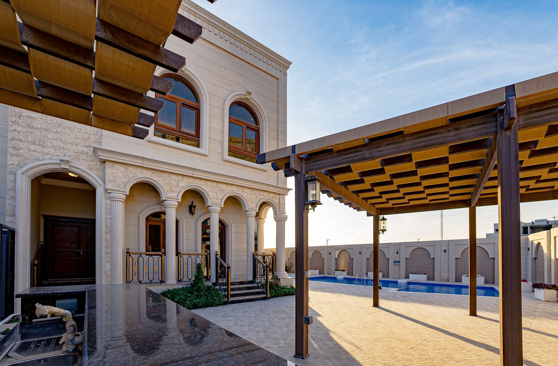 Finished GCC property exterior with pool and pergola